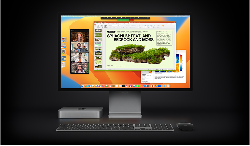 Mac mini med Magic Mouse, Magic Keyboard og Studio Display, hvor en Microsoft PowerPoint-præsentation bliver delt under et Zoom-møde, mens Noter-appen kan ses i baggrunden.