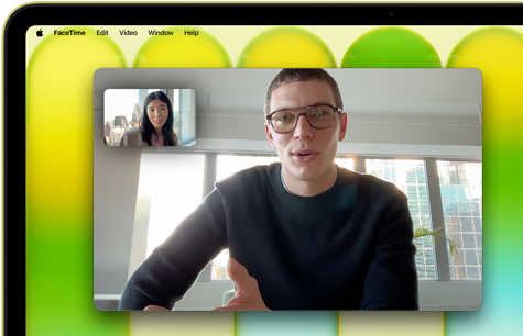 MacBook Neo, värinä sitrus, näytöllä videopuhelu, valokeilaominaisuus pitää käyttäjän keskellä kuvaa